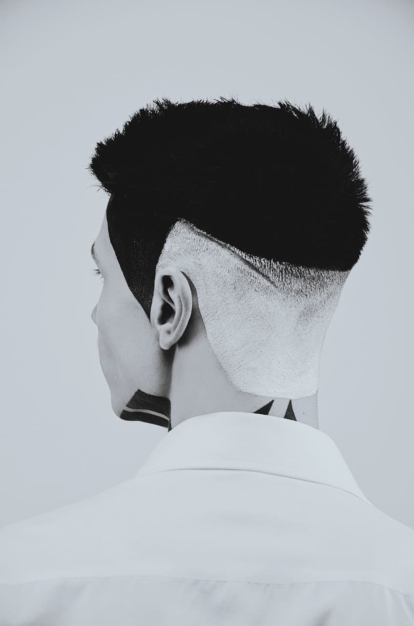 The back of a fresh skin fade, sharp line at the neck