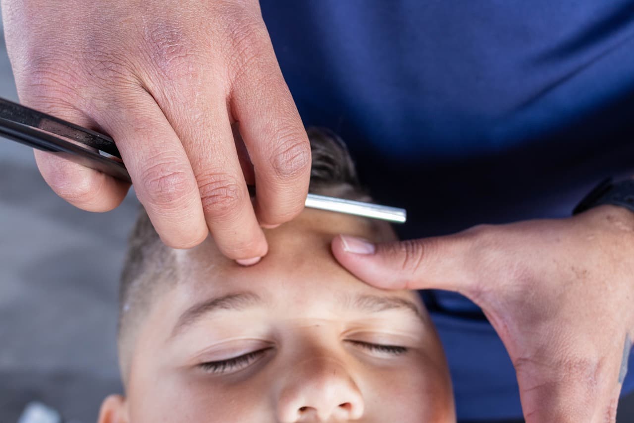 A straight-razor shave along the hairline